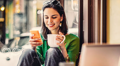 Image of woman looking at her phone