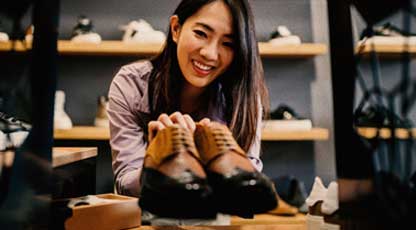 A person looking to buy shoes