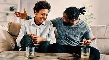 A father and son sitting and talking together