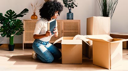 Person packing a box