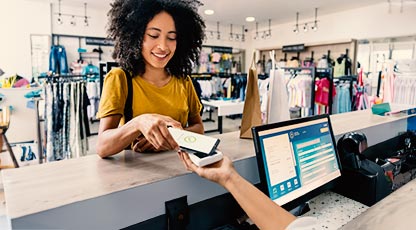 A women using her phone to pay for a purchase