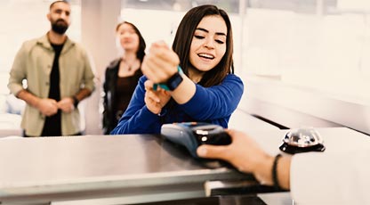 Person making a tap payment with a smart watch