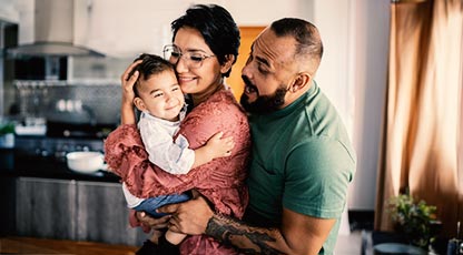 Young parents holding a toddler