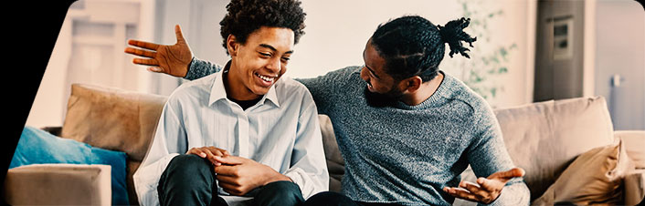 A father and son sitting and talking together
