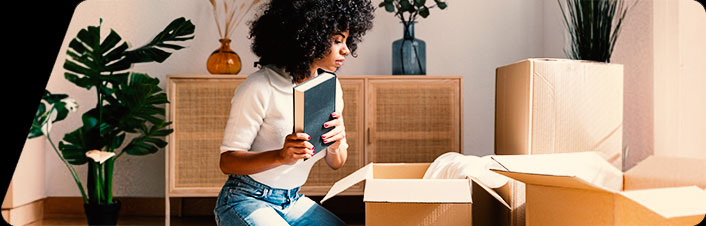 Person packing boxes