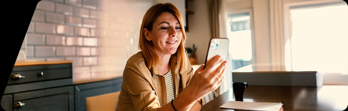 Image of a women looking at her phone